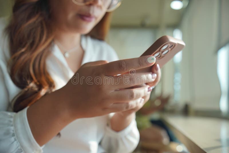 Woman discovering new beauty styles on her phone