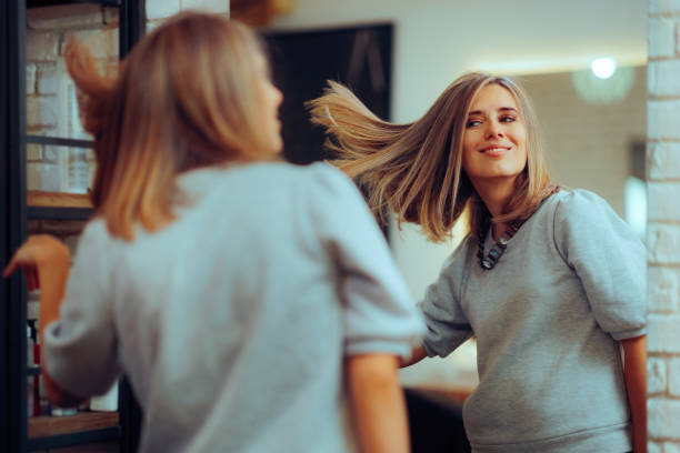 Confident woman admiring her new hairstyle transformation